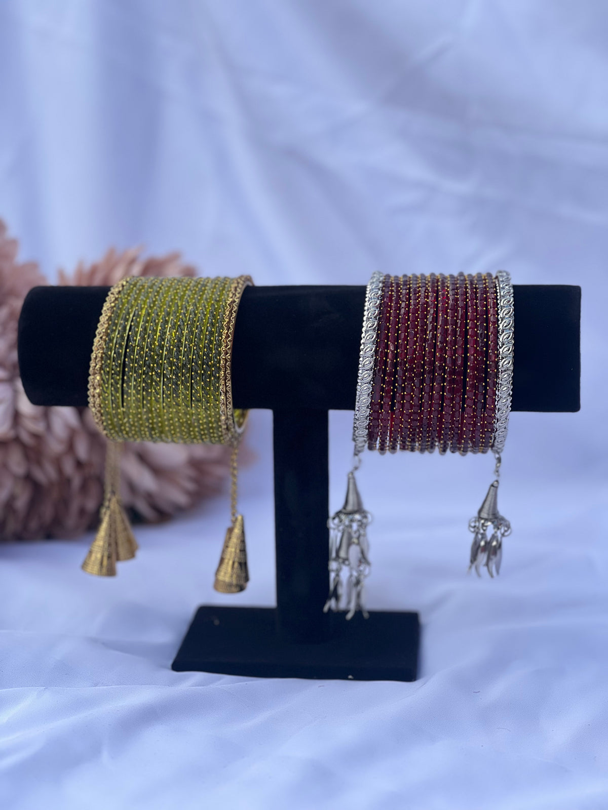 Chura bangles set in olive green with gold tassels and maroon with silver tassels