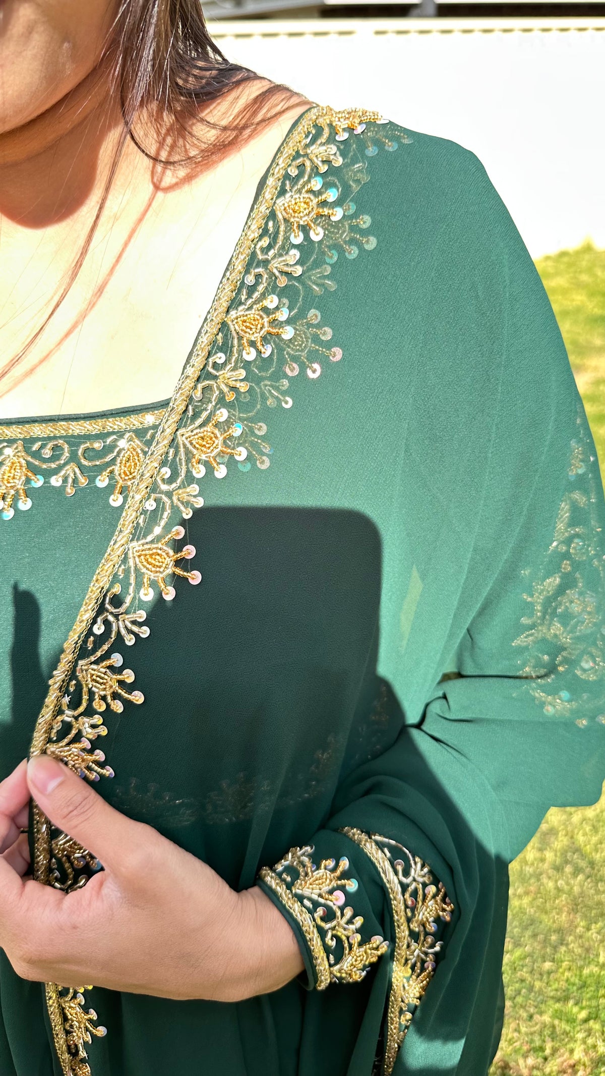 Deep green Anarkali dupatta and neckline detail