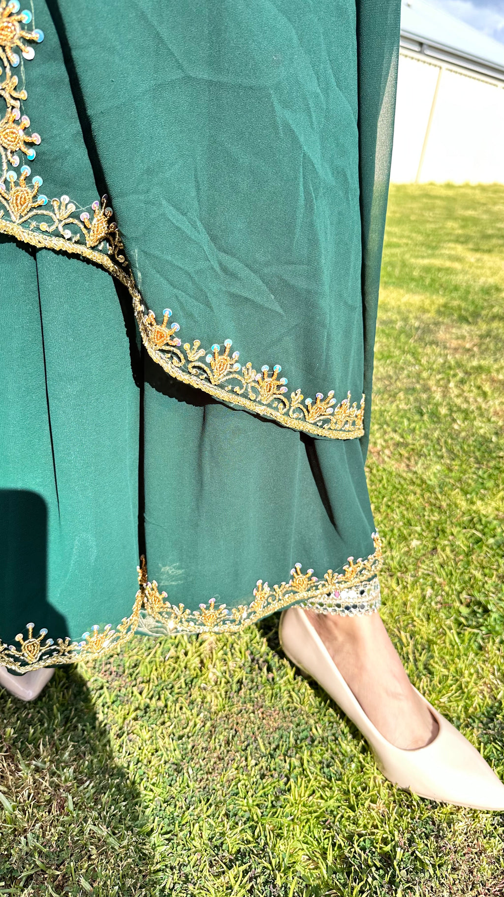 Deep green Anarkali hem and pants gold zari border detail