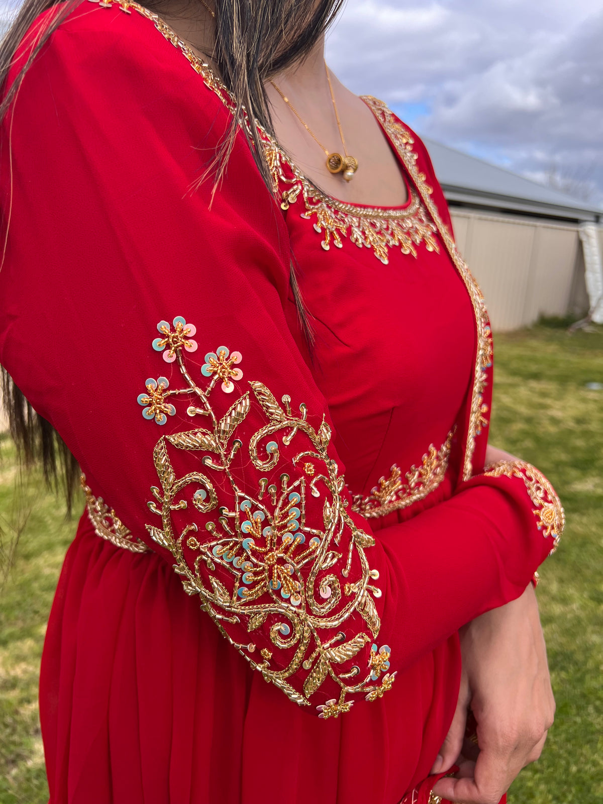 Rich red Anarkali neckline and waist gold trim detail